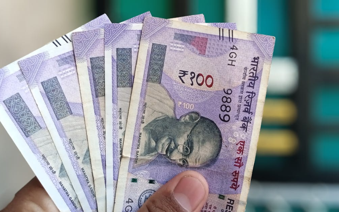 The Indian rupee steadied near 93 to the dollar as the RBI's intervention calmed volatility following record lows.