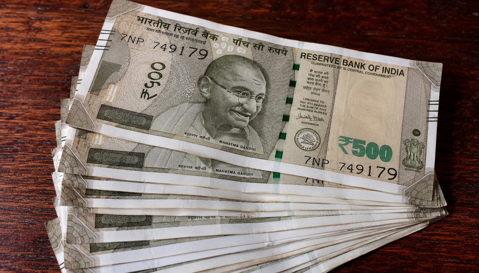 Rupee hits record low as oil surge strains finances