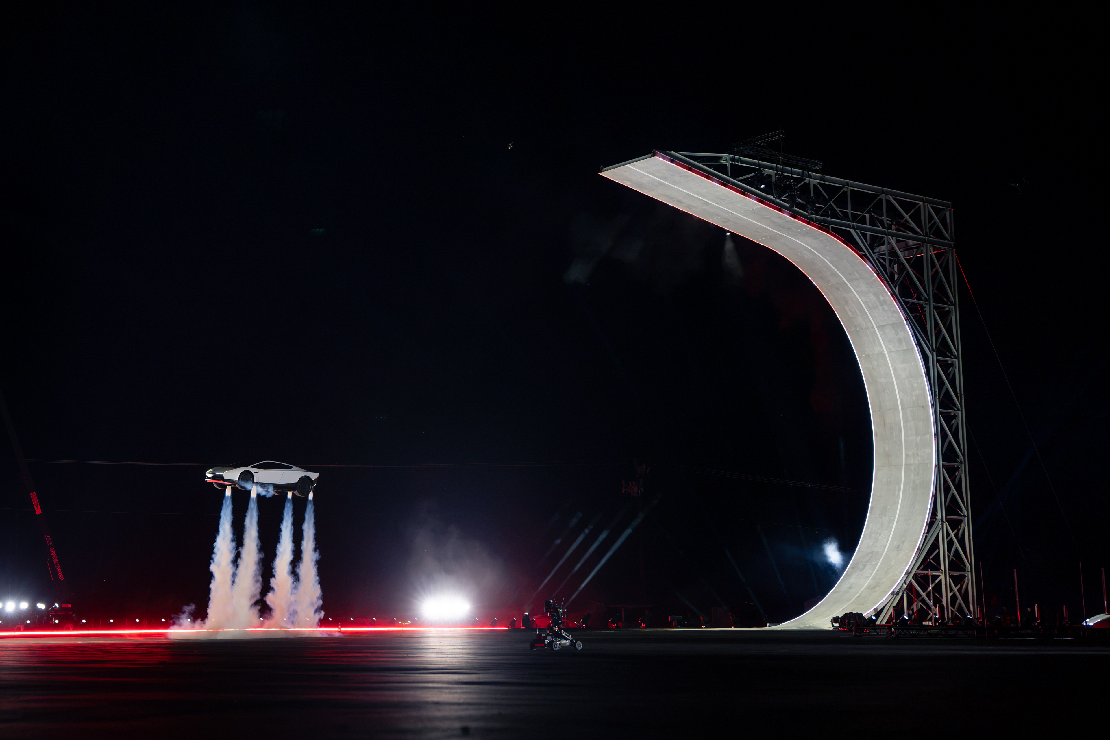 Roadster Stunt Demonstration with Vertical Ramp Structure
